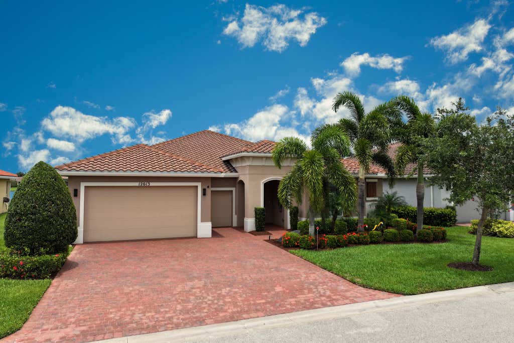 Photo of 12013 SW Marigold Avenue, Port Saint Lucie, FL 34987 (MLS # R10994695)