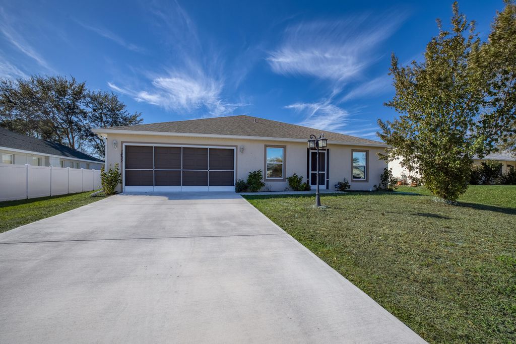 Photo of 1432 SW Leisure Lane, Port Saint Lucie, FL 34953 (MLS # R11160923)