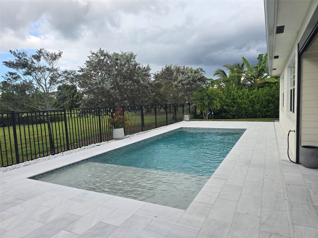 Photo of 987 Castaway Ct, Loxahatchee, FL 33470 (MLS # F10532634)
