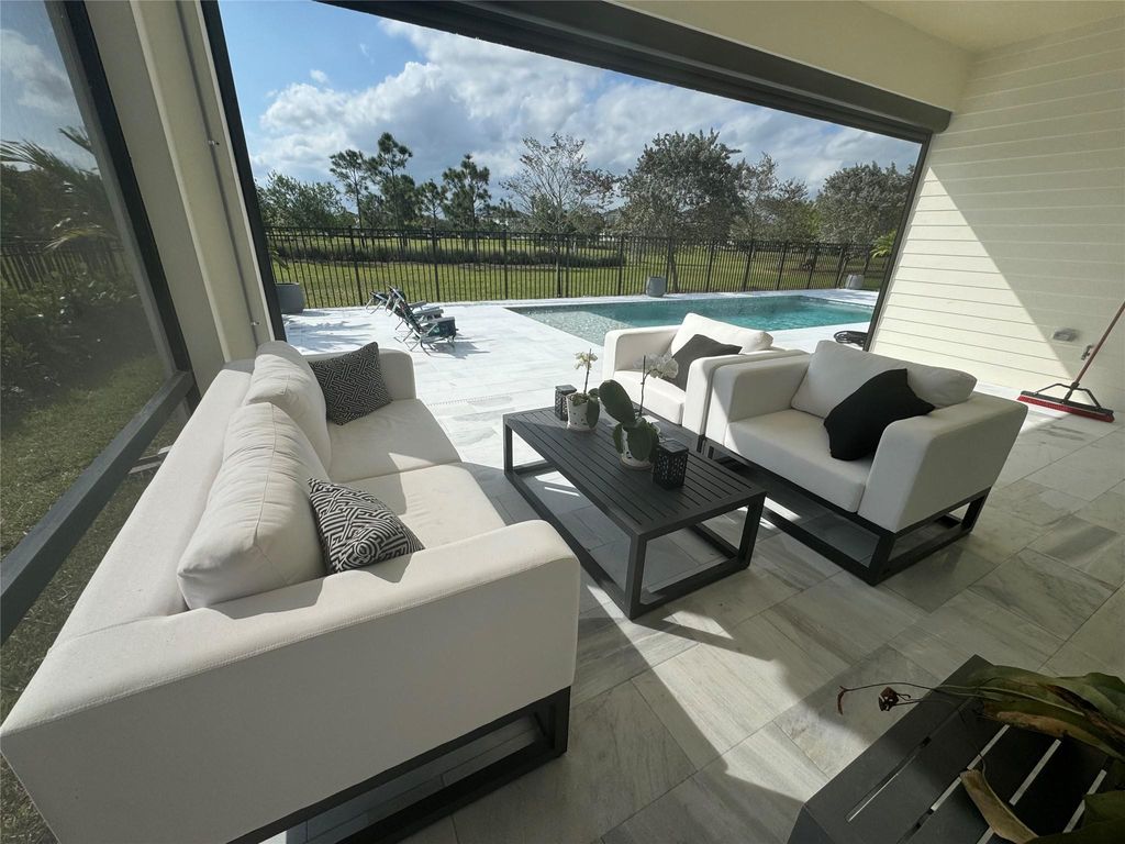 Photo of 987 Castaway Ct, Loxahatchee, FL 33470 (MLS # F10532634)