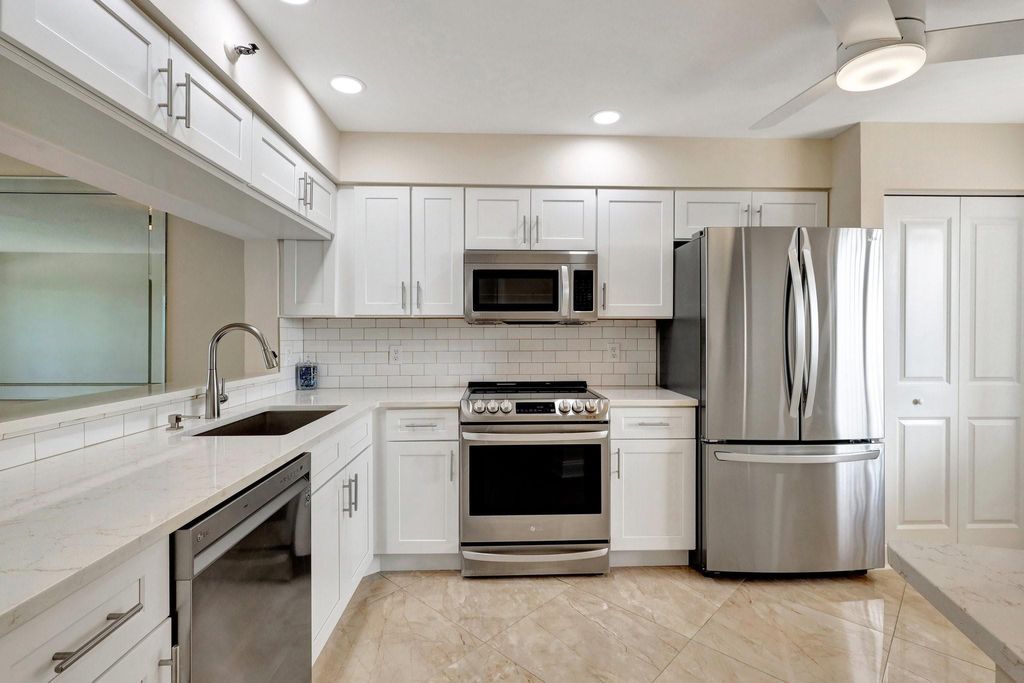 Photo of 14460 Strathmore Lane, Delray Beach, FL 33446 (MLS # B26020508)