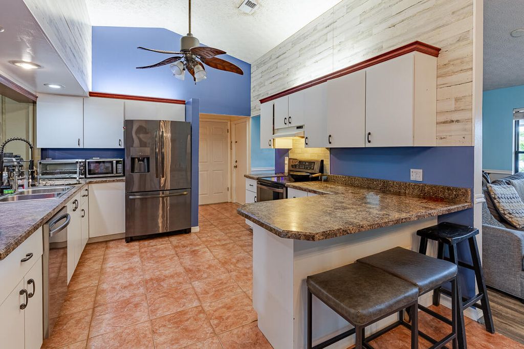 Photo of 418 SE Langfield Avenue, Port Saint Lucie, FL 34984 (MLS # R11157956)