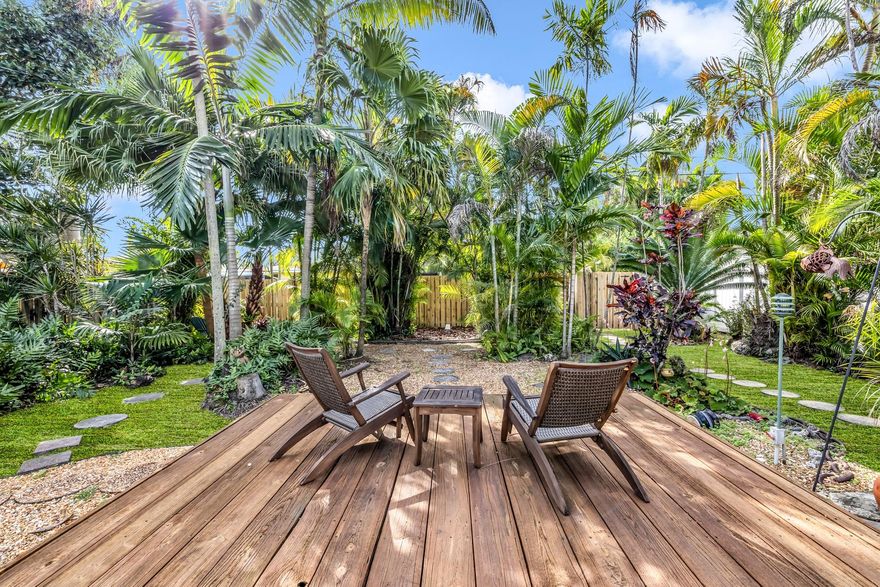 Immaculate 2 bed, 2 bath home in Sunny Acres, Hollywood, FL, exuding light and warmth. A well-maintained haven with a 10-year-old tile roof, new AC, and upgraded electric system. The kitchen boasts modern appliances and elegant stone countertops. Enjoy the seamless flow of tile and terrazzo floors throughout. The exterior, recently refreshed with pressure washing and paint, complements the tropical landscaping. A fenced backyard ensures privacy, and the deck is adorned with charming lighting. Additional features include a new washer/dryer and all upgrades done with proper permits. Welcome to a blend of comfort and style.