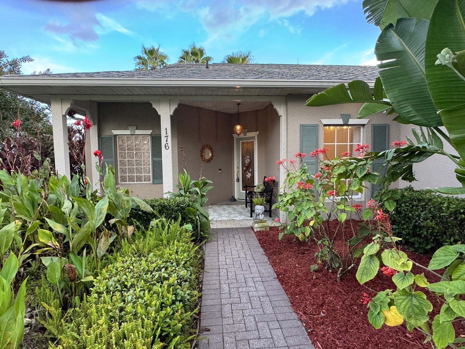 100% Designer Remodel! New flooring, cabinets, lighting, tile, paint, trim, kitchen & baths! HUGE corner lot with the nicest neighbors.Water views & moon views from the glass conservatory overlooking a 122' garden. Designer kitchen has new floating shelves & cabinets with quartz countertops & NEW appliances. The 6 person seating peninsula will be the center of this entertainer's dream home. Custom tile work. Feature walls in the den, living room and master bedroom. New garage epoxy floor.Butcher block laundry folding counter. Phantom screen on the stain glass front door & retractable canopy over the back patio. Enjoy the restaurants, gym, active life style in the golf course & nature community of gated Solivita!