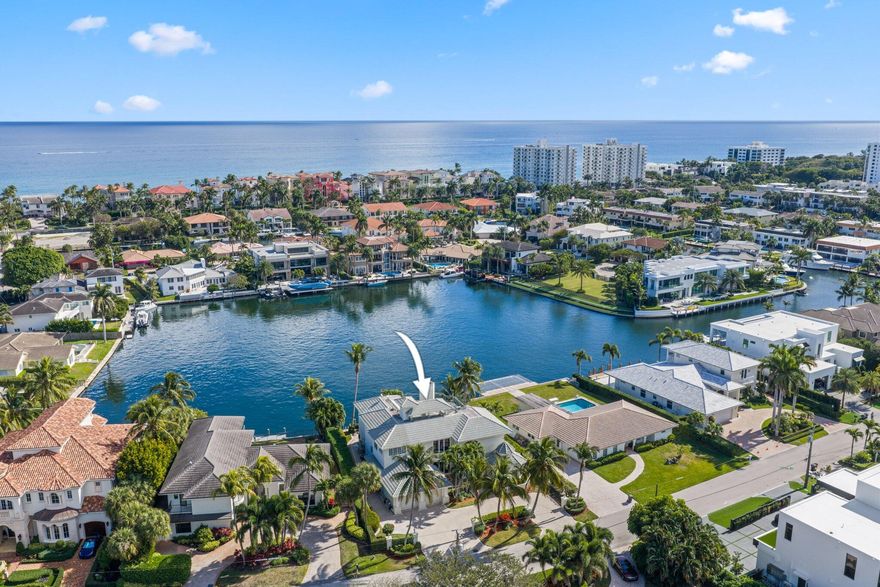Incredible Waterfront home situated on the most coveted section of exclusive Bel Lido Isle, positioned on the widest expanse of the basin with premiere Southeast exposure delivering panoramic water views, steady Atlantic Breezes & Direct Intracoastal access w/ the protection of the deep-water harbor. Features include a Grand Foyer with a sweeping wrought-iron staircase & soaring ceilings The living room is light filled w/ a fireplace and built in bar The formal Dining room has an elegant butler's pantry w/custom glass-front cabinetry. The Gourmet chef's kitchen features custom wood cabinetry, oversized center island w/ premium appliances including a gas range w/ warming lights and a warming drawer. Off the kitchen is the family room & adjoining breakfast area w/ expansive water views On the Upper level there is an entertaining area with a fireplace and private balcony, serving as a central gathering space for the upstairs bedrooms which are situated off the area. There are 2 laundry rooms, one downstairs and one up in the master suite. The master suite is completed with a beautiful bath with a spa tub and dual headed shower and an office/ exercise room adjoining. There is also an area for an elevator if so desired. 
There is also an outdoor staircase to a 3rd floor patio where a bar can be added and an elevator can access. The views from here are phenomenal. The home also has a Generator. For the boater the dockage is incredible on this protected basin with direct Intracoastal access with no fixed bridges. All of this and on Bel Lido you get keyed beach access just a short stroll away. True Florida Living!!