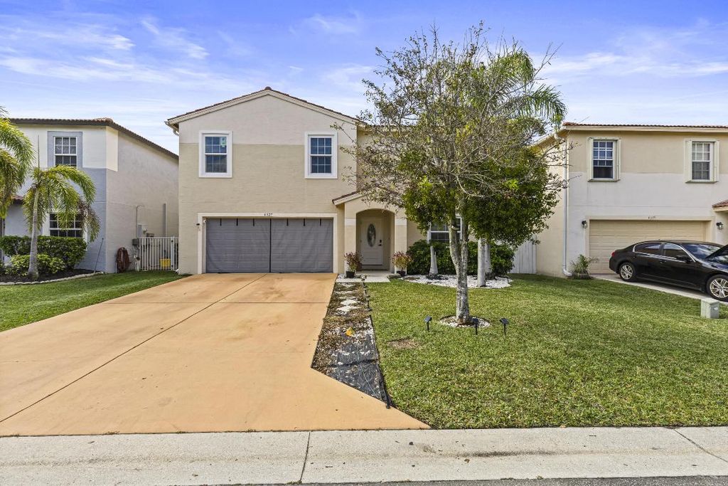 Photo of 6627 Rainwood Cove Lane, Lake Worth, FL 33463 (MLS # R11052889)