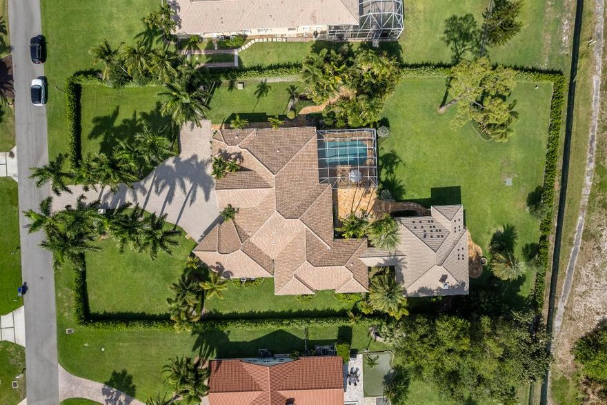 Seven bedrooms total, 5458 square feet on 1.04 acres with 5 Bedrooms and 5 full baths in the main house and a two-bedroom, 1 bath, guest house. High end appliances like Wolf and Sub-Zero, and finish details such as massive, solid wood entrance doors and superb theater room millwork, distinguish this home that was featured in Palm Beach's ''Simply the Best''. With a new roof, impact windows and commodious layout that afford great privacy, this home is a high value turnkey proposition.