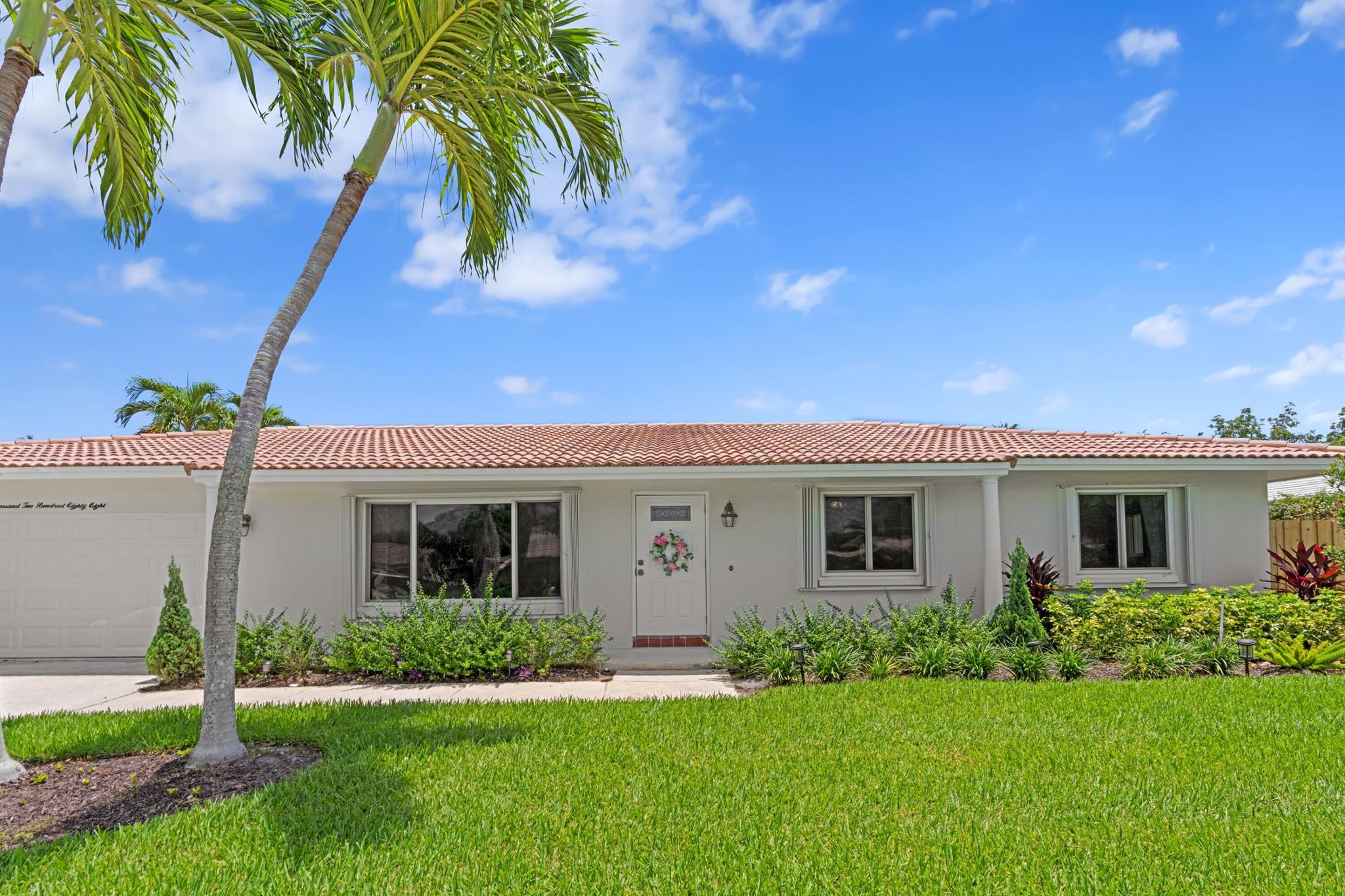 Located in the heart of Boca Raton and served by A-rated schools, this spacious and well-maintained 4BR/3BA home sits on a large lot with a beautiful pool and expansive backyard. The thoughtful floor plan offers split bedrooms for privacy, a formal living room, and a large family room with a cozy fireplace. All impact glass provides peace of mind and storm protection. Close to great shopping, dining, and Woodlands Park, this home combines comfort, functionality, and an unbeatable Central Boca location.