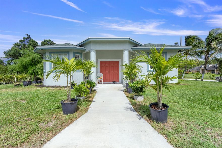 Discover a beautifully finished 2-bed, 2.5-bath, one car garage, guesthouse in peaceful Loxahatchee. Set on a large lot, this light-filled home offers an open living area, modern kitchen with shaker cabinets, quartz counters, stainless appliances, and ceramic flooring throughout. Enjoy a private entrance, dedicated driveway parking, covered patio, and in-unit laundry. Minutes to Westlake shopping, parks, and major roads--yet tucked away from the hustle. Lawn care, electricity, and water included; fast internet available. Pets considered with approval. No HOA. Ideal for quiet tenants seeking space and country charm with suburban convenience. Available now--easy to show.