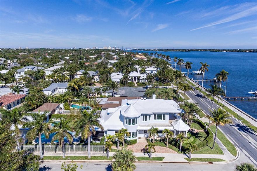 Stunning 4 bedroom/4.5 bath waterfront home with breathtaking intracoastal views. Custom built in 2008 and extensively renovated in 2020, offering an open floor plan, complete impact glass, 10+ ft ceiling height, elevator, full house generator, summer kitchen, home gym, and much more! Includes a brand new swimming pool with custom lap section, complete with jacuzzi spa and sun shelf. A large master suite includes an expansive master closet, office, and wraparound covered balcony great for relaxing and watching the boats go by. Impeccably landscaped grounds adorned with exotic palm trees, decorative water fountain, fully fenced, and boasting a 190 ft. deep corner lot. This ''SoSo'' waterfront gem is extensively renovated, reimagined, and ready for immediate occupancy. Riparian rights allow you to build a dock directly on the intracoastal waterway and only a short ride to the Palm Beach inlet. Situated on a large 13,000+ sq. ft. corner lot with south and east exposure provides for an abundance of natural light. Includes a 2 car garage and circular driveway. Located in the coveted South of Southern neighborhood of West Palm Beach, minutes away from downtown WPB, Palm Beach island, the ocean, and PBI airport.