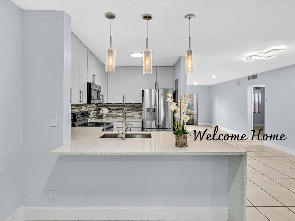 Photo of 301 N Pine Island Road #113, Plantation, FL 33324 (MLS # F10460581)