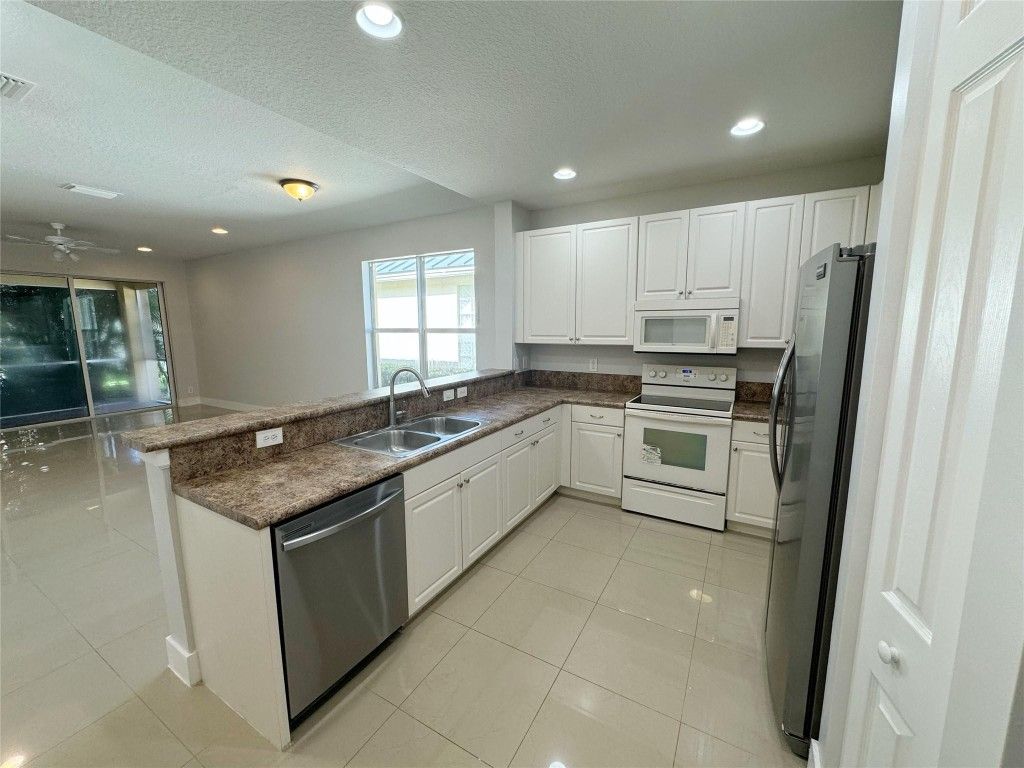 Photo of 236 Belle Grove Lane, Royal Palm Beach, FL 33411 (MLS # F10468816)