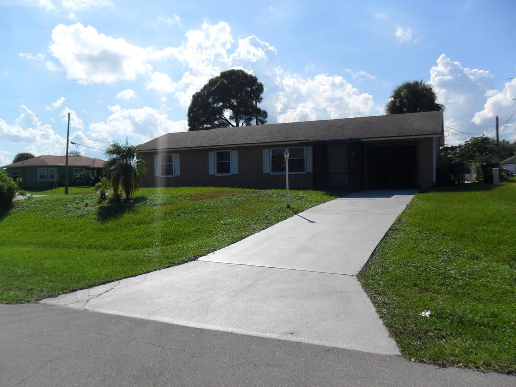 Photo of 2574 SW DECKARD Street, Port Saint Lucie, FL 34953 (MLS # B26076799)