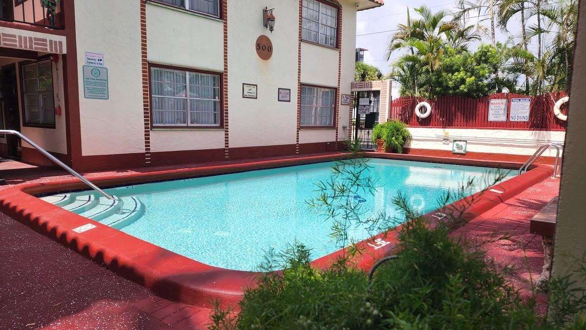 Beautifully furnished 2/1 apartment move-in ready! Ideal for students or anyone seeking comfort, convenience and a touch of tropical charm. The gated complex offers a peaceful garden-like setting with lush palm trees and greenery. Take advantage of the on-site pool, outdoor grill and shaded tables perfect for unwinding or entertaining. Inside you'll find a spacious layout complete with appliances, utensils, bedding, towels and furnishings - just bring your suitcase!Minutes from American Flyers, FAU and BCC. Fantastic for academic life or seasonal relaxation. Enjoy being 2 miles from the beach, easy access to major highways, shopping centers and a variety of local restaurants. Whether you're looking for a long-term stay or a seasonal retreat, this rental has it all.