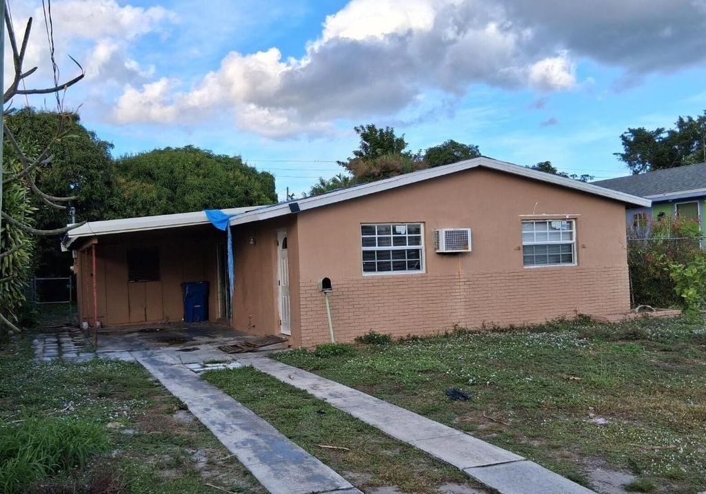 Photo of 1240 W 33rd Street, Riviera Beach, FL 33404 (MLS # R11146878)