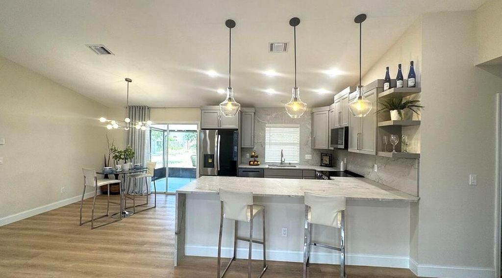 Photo of 889 SW Nichols Terrace, Port Saint Lucie, FL 34953 (MLS # R11090084)