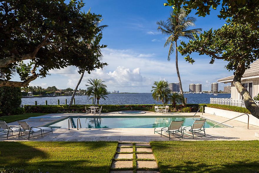 This property with unmatched views of Lake Worth & deep water dockage for a yacht in excess of 100 ft., is arguably the finest opportunity in the area.  The spacious, 2-story home has 5 bedrooms, a maid's quarters with full bath, & a one bedroom pool house.  The glass enclosed loggia offers a large open sitting area with spectacular water views, along with casual dining perfect for enjoying a relaxing lunch overlooking the terrace & sparkling pool. Two gracious living rooms provide ample space to entertain or enjoy a game of bridge with friends.  The formal dining room is just off the kitchen & pantry area. The property is located in one of the most exclusive private communities in Florida which offers golf, tennis, a state-of-the-art fitness facility, private beach & first class security.