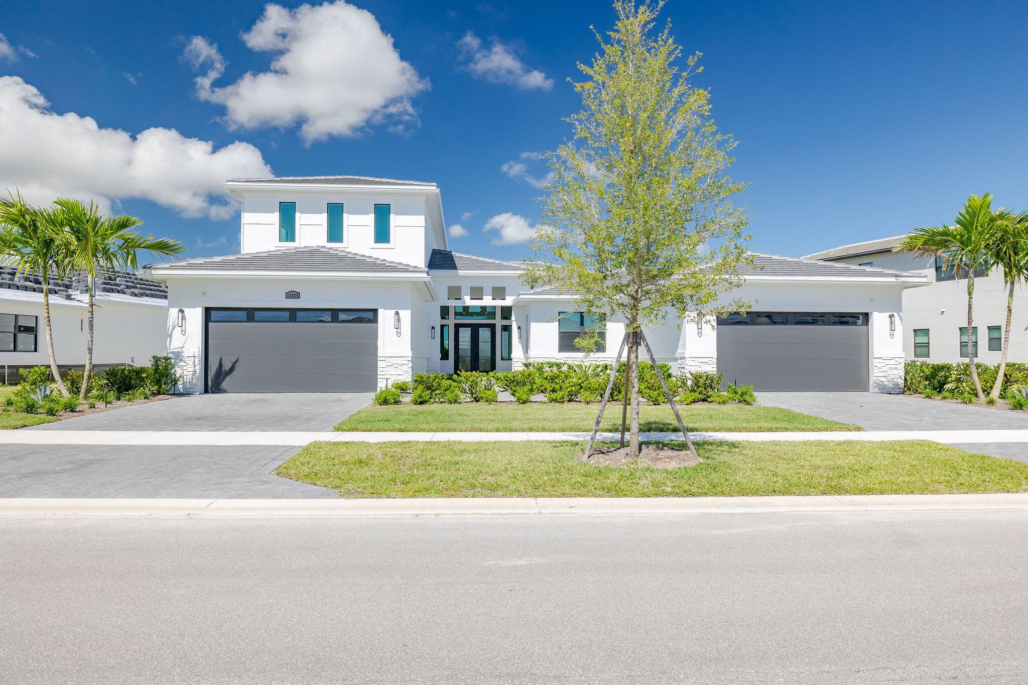 Discover upscale lakefront living with serene Astor Creek Golf Course views in this stunning 5-bedroom, 5.5-bath residence. Thoughtfully designed with an expanded Owner's Suite and a spacious screened lanai, perfect for entertaining or relaxing in style.No wait to build--move right in and start enjoying Astor Creek's premier lifestyle. Seller is including a $50k initiation fee for the golf membership that will be included to Astor Creek Golf Course, allowing you to experience resort-style living from day one. The gourmet chef's kitchen is a true centerpiece, featuring a 36'' cooktop and hood, double wall ovens, second-tier cabinetry, sleek quartz surfaces, and a bar area with wine fridge. A flexible bonus room offers the ideal space for a home office, gym, or media room.