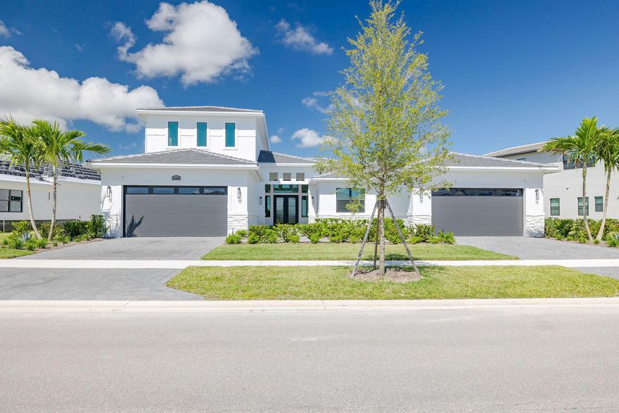 Discover upscale lakefront living with serene Astor Creek Golf Course views in this stunning 5-bedroom, 5.5-bath residence. Thoughtfully designed with an expanded Owner's Suite and a spacious screened lanai, perfect for entertaining or relaxing in style.No wait to build--move right in and start enjoying Astor Creek's premier lifestyle. Seller is including a $50k initiation fee for the golf membership that will be included to Astor Creek Golf Course, allowing you to experience resort-style living from day one. The gourmet chef's kitchen is a true centerpiece, featuring a 36'' cooktop and hood, double wall ovens, second-tier cabinetry, sleek quartz surfaces, and a bar area with wine fridge. A flexible bonus room offers the ideal space for a home office, gym, or media room.