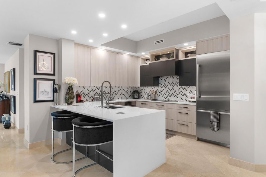 ***Rare Opportunity***  FLAWLESS.  Completely unique unit with modified open floorplan with the finest finishes money can buy.. No expense spared!!  Stunning Ocean + Intracoastal views from almost every room.  Step into a world of elegance & convenience, where every detail has been meticulously crafted. Full-service building with roof top pool, sauna, steam room, BBQ's, fitness center, clubroom, valet, and 24/7 concierge. Pet friendly, walk to City Place, Clematis and the Waterfront. 10 Minutes to PBI airport. This is downtown luxury at its finest. 2 garage parking spaces equipped with electric for car charging stations.