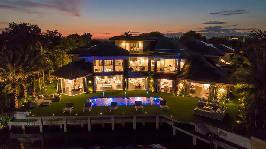 Reimagined Sanctuary Deepwater Estate-like Mansion sited on 105+/-  feet of water frontage with long water views has been re-designed and expanded with a warm modern flair.  A fabulous opportunity to acquire an exquisitely renovated estate (2018) on a prime Sanctuary waterfront setting with expansive motor court entry.  High ceilings and vast open spaces and retractable doors set the tone for indoor/outdoor entertaining.  Resort – style patio with carefree turf patio, brand new pool with LED lighting and fountain feature. New Dock for your water vessel. Shown by appointment only. DISCLAIMER: Information published or otherwise provided by the listing company and its representatives including but not limited to prices, measurements, square footages, lot sizes, calculations and statistics are deemed reliable but are not guaranteed and are subject to errors, omissions or changes without notice. All such information should be independently verified by any prospective purchaser or seller. Parties should perform their own due diligence to verify such information prior to a sale or listing. Listing company expressly disclaims any warranty or representation regarding such information. Prices published are either list price, sold price, and/or last asking price. The listing company participates in the Multiple Listing Service and IDX. The properties published as listed and sold are not necessarily exclusive to listing company and may be listed or have sold with other members of the Multiple Listing Service. Transactions where listing company represented both buyers and sellers are calculated as two sales. The listing company's marketplace is all of the following: Vero Beach, Town of Orchid, Indian River Shores, Town of Palm Beach, West Palm Beach, Manalapan Beach, Point Manalapan, Hypoluxo Island, Ocean Ridge, Gulf Stream, Delray Beach, Highland Beach, Boca Raton, East Deerfield Beach, Hillsboro Beach, Hillsboro Shores, East Pompano Beach, Lighthouse Point, Sea Ranch Lakes and Fort Lauderdale. Cooperating brokers are advised that in the event of a Buyer default, no commission will be paid to a cooperating Broker on the Deposits retained by the Seller. No commissions are paid to any cooperating broker until title passes or upon actual commencement of a lease. Some affiliations may not be applicable to certain geographic areas. If your property is currently listed with another broker, please disregard any solicitation for services. Copyright 2021 listing company All Rights Reserved.