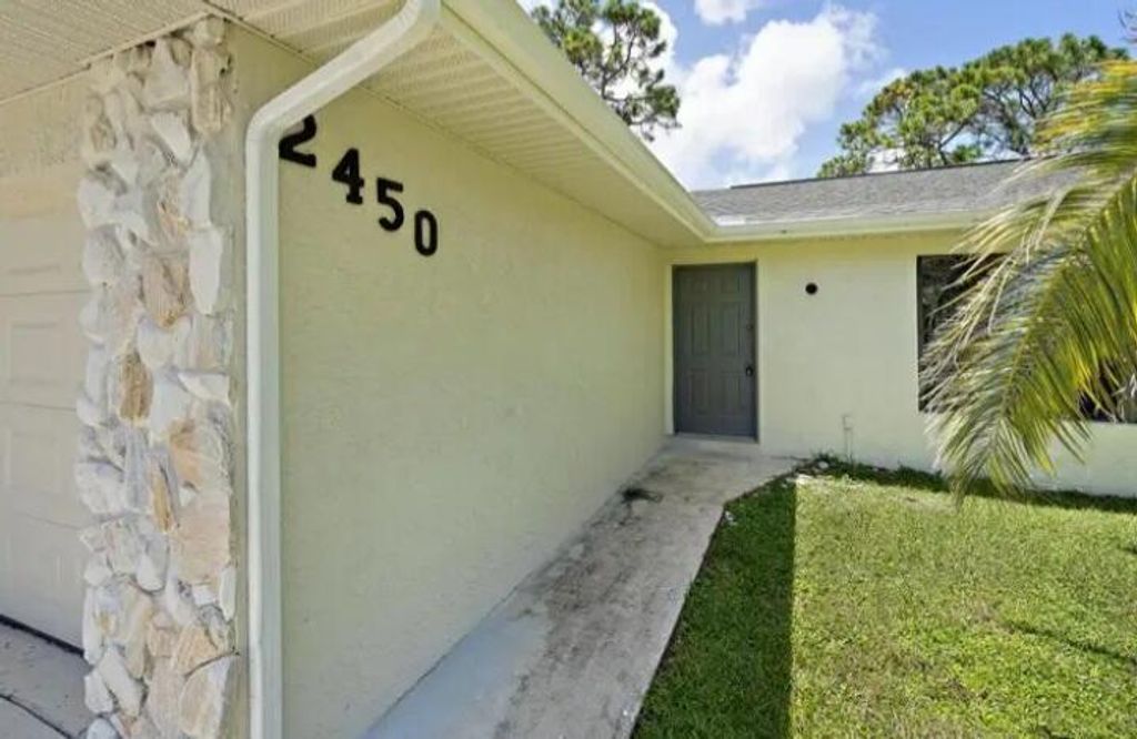 Photo of 2450 SW Bayshore Boulevard, Port Saint Lucie, FL 34984 (MLS # R11099556)