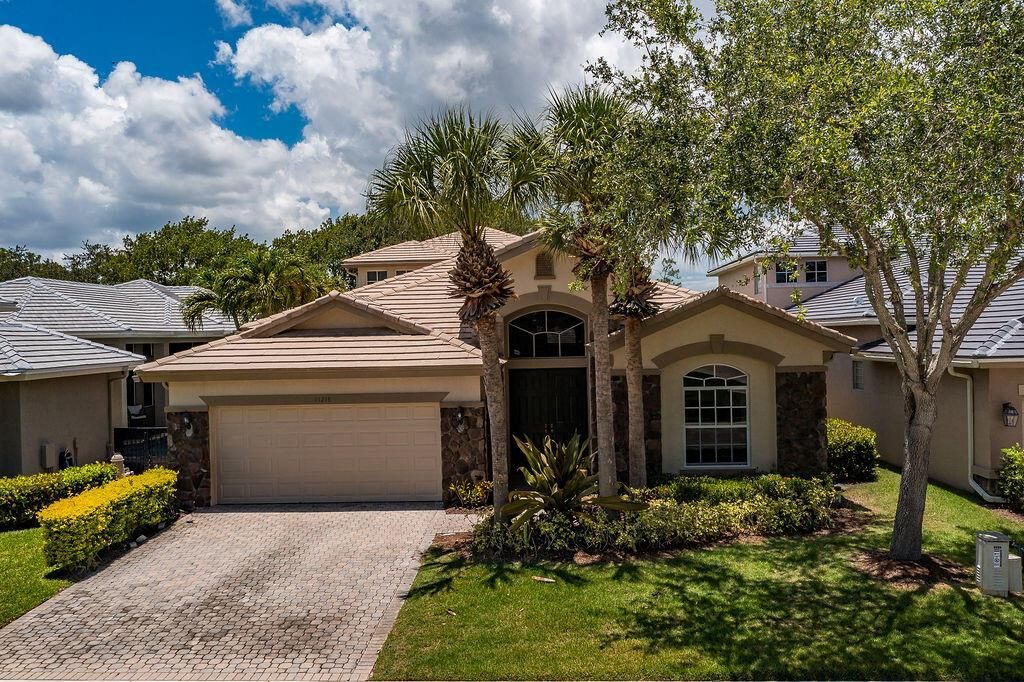 Photo of 11218 Osprey Lake Lane, Palm Beach Gardens, FL 33412 (MLS # R11101127)