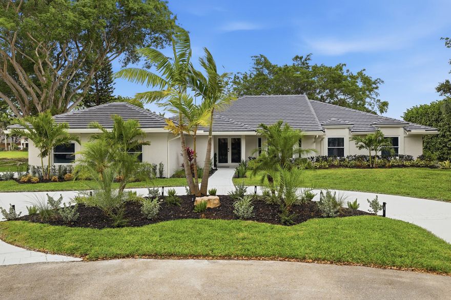 Welcome to 7411 Dover Lane, a beautiful, fully renovated five bedroom, four and a half bathroom waterfront estate tucked away on a quiet cul-de-sac in the sought after Cypresshead community of Parkland. Set on a rare three-quarter acre lot with long water views, this 3,337 square foot refined, move-in ready home blends thoughtful design, premium finishes, and recent upgrades to deliver a turnkey lifestyle in one of South Florida's most desirable neighborhoods. As every major upgrade has already been completed, you will be able to enjoy the home from day one. From the moment you arrive, the home presents with intention. Professionally designed landscaping, custom lighting, and an expansive setback create a strong sense of arrival, while the oversized lot delivers a level of space and privacy rarely found in the area. This lot is a rare find in Parkland, offering exceptional space, privacy, and a peaceful waterfront backdrop that creates a true sense of retreat.               Inside, the residence has been completely reimagined with a focus on clean lines, quality materials, and functional design. Custom doors, detailed trim work, and fully built-out closets in every bedroom elevate the entire interior. The layout is open yet defined, with multiple living and entertaining spaces that naturally draw your attention toward the water.  At the center of the home is a thoughtfully designed, chef-level kitchen that balances form and function.                Outfitted with GE profile double ovens, double sinks, and double dishwashers, along with a 48-inch built-in refrigerator, Wolf induction 36-inch cooktop and Wolf microwave drawer, the space is designed to perform during both everyday use and large-scale entertaining.                The primary suite serves as a true retreat, complete with a stunning custom marble bathroom with a spa-like feel and a level of finish consistent with high-end custom homes. Secondary bathrooms carry the same material quality and attention to detail, creating a cohesive design throughout.                  Step outside and the resort style backyard truly comes to life. The pool has been fully refinished with new Diamond Brite, glass tile, and updated lighting, creating a clean, modern look. A brand new 2026 screen enclosure with picture window panels frames the water views beautifully while maintaining comfort and openness. The cul-de-sac location combined with the waterfront setting provides a quiet, private backdrop that is difficult to replicate.   Beyond aesthetics, this home delivers where it matters most. A brand new 2026 roof, full impact windows and doors, two new Rheem air conditioning systems, a new 80 gallon water heater, new gutters, whole house water softener and filtration, sprinkler pump and epoxy garage provide long-term durability and peace of mind.               Cypresshead is known for its tree lined streets, oversized lots, and welcoming community atmosphere.  In Cypresshead, where lot size and location drive long-term value, opportunities that combine waterfront positioning, nearly an acre of land, full hurricane protection, a chef-level kitchen, and a complete top-to-bottom renovation are extremely limited. Residents can further enjoy convenient access to parks, shopping, dining, and major roadways, making it easy to enjoy everything Parkland and the surrounding area have to offer.                7411 Dover Lane offers a level of finish, privacy, and readiness that stands apart from typical renovated homes in this market. Schedule your private tour today and experience everything this exceptional Parkland property has to offer.