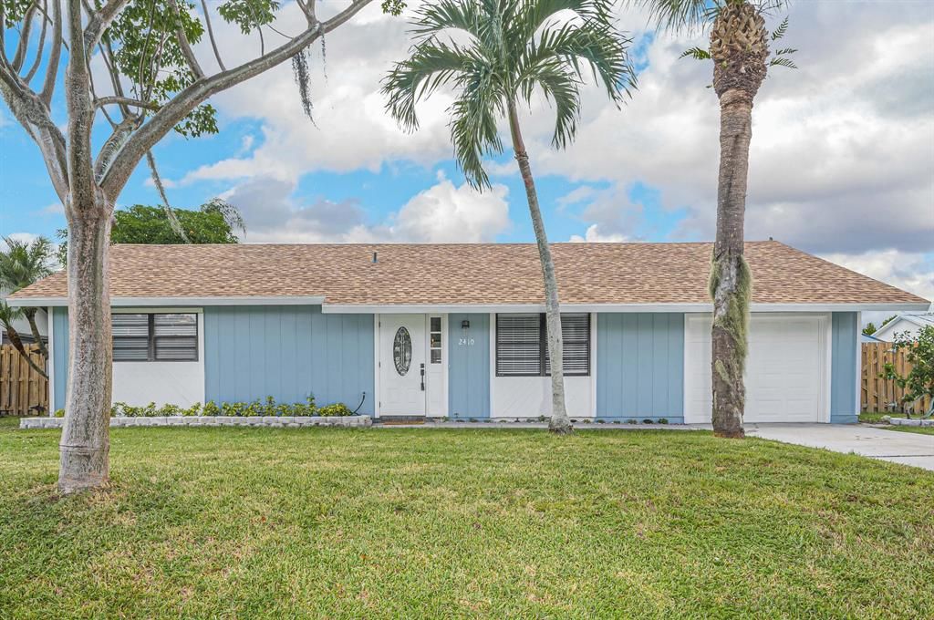 Photo of 2410 SW Hinchman Street St, Port Saint Lucie, FL 34984 (MLS # R10828463)