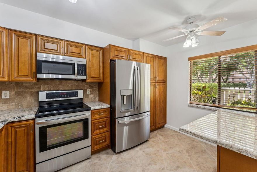 Welcome to your dream home in the prestigious Huntington Lakes community of Delray Beach! This charming 2 bedroom, 2 bathroom condo offers the epitome of comfortable and luxurious living. As you pull up, convenience is at your doorstep with parking right in front of your private entrance to your garden condo. Step inside to discover the spacious and inviting Large Lancaster model. The heart of this home is the beautifully remodeled kitchen, featuring Quartz countertops, a stylish tile backsplash, stainless steel appliances, and a convenient pantry for all your storage needs. Entertain guests in the large, bright living-dining room, or step out to the great rear enclosed patio and soak in the magnificent, unobstructed lake views. With full hurricane impact sliding windows and doors, peace of mind is guaranteed even during stormy weather.
Retreat to the main bedroom, which offers direct access to the patio and features two walk-in closets for ample storage space. The main bathroom is a true oasis, boasting seamless shower doors and modern finishes for a spa-like experience. The guest bedroom is equally inviting, with an updated bathroom ensuring comfort and convenience for visitors.

Additional highlights of this impeccable condo include a separate laundry room, stainless steel appliances, a foyer, pantry, and walk-in closet for added functionality.
Outside, indulge in the luxurious amenities of the Huntington Lakes community, including a gorgeous clubhouse and brand new Har-Tru tennis courts, perfect for staying active and socializing with neighbors. Take advantage of the pickleball courts for even more recreational options.
Don't miss this opportunity to experience resort-style living at its finest in one of Delray Beach's most sought-after communities. Schedule your showing today and make this exquisite condo your own!