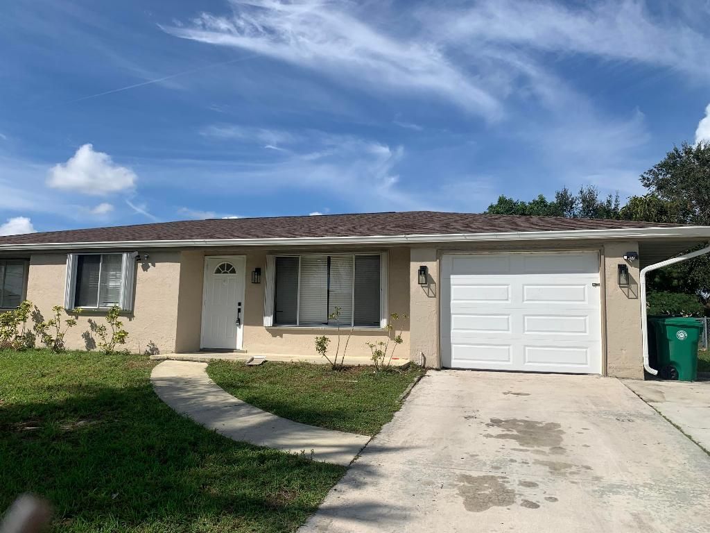Photo of 445 SW Tulip Boulevard, Port Saint Lucie, FL 34953 (MLS # R10933540)