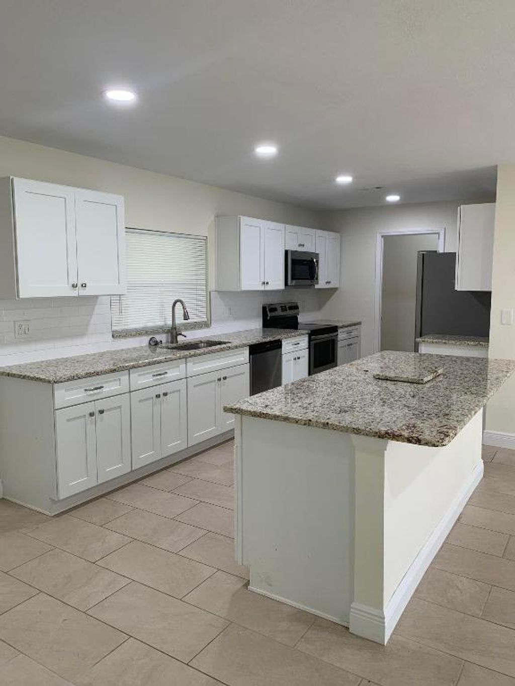 Photo of 445 SW Tulip Boulevard, Port Saint Lucie, FL 34953 (MLS # R10933540)