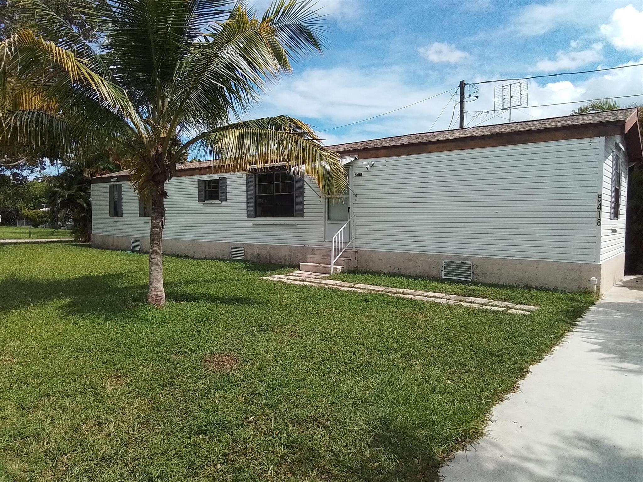 This 2 bed 2 bath recently painted manufactured home sits on a large corner lot off Salerno Rd and US 1 making this an ideal location. The kitchen includes a refrigerator, microwave and a newer stove. The primary bedroom has a walk-in closet, a bathroom with a combination tub/shower, a new vanity and a linen closet. The 2nd bath also has a new vanity and combo tub/shower. There is both central air and a window unit for your convenience. Washer and dryer are inside the home. This home has no carpeting. A pet under 20 lbs will be considered with a $300 non refundable pet deposit. There is a small area outside to sit and relax. A metal shed for storage is available. Application fee $50. Tenant must have 100k tenant insurance.