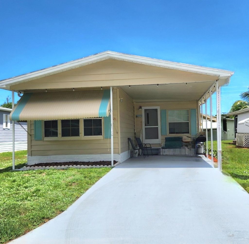 Photo of 21 Camino Del Rio, Port Saint Lucie, FL 34952 (MLS # R11102926)