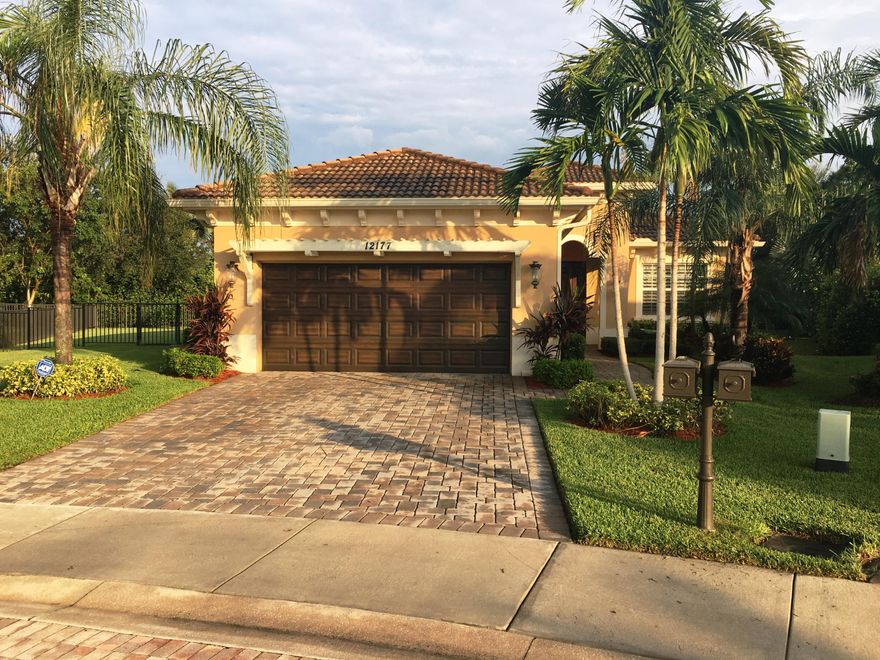 Desirable single story 3-bedroom, 2.5 baths, 2 car garage Alondra model home built in 2012 in the highly sought-after community of Paloma in Palm Beach Gardens. Private 1/3 acre fenced yard facing southeast has gorgeous salt water pool with fountains.  Kolter built home with hurricane impact resistant windows and doors (did not lose electricity during recent hurricanes). Home features dark wood floors thru-out, beautifully tiled baths, crown moldings, tray ceiling, open concept family room with lovely eating space overlooking pool, large island in kitchen with all stainless steel appliances including double wall ovens and cook top, light quartz countertops, and cherry cabinetry, butler pantry separating kitchen from formal dining room, plantation shutters, master suite with his and hers... ...closets, roman tub and large, separate walk-in shower, and split bedrooms with guest wing featuring full and half bath.  This house is in immaculate new condition! Paloma is a fantastic gated community in the heart of Palm Beach Gardens and is conveniently located close to world class shopping, restaurants, golf courses, beautiful beaches, fishing, boating, PBIA, Palm Beach Island and all this area in paradise has to offer. Homeowners' fee includes basic cable, Internet, ADT security monitoring, virtual guard entrance, and landscaping front and back.