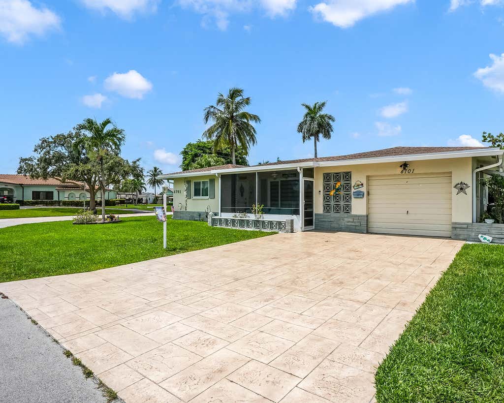 Photo of 4701 NW 47th Terrace, Tamarac, FL 33319 (MLS # B26062856)