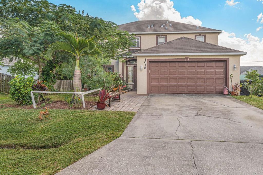 Photo of 1038 SW Liberty Ave, Port Saint Lucie, FL 34953 (MLS # R10935193)