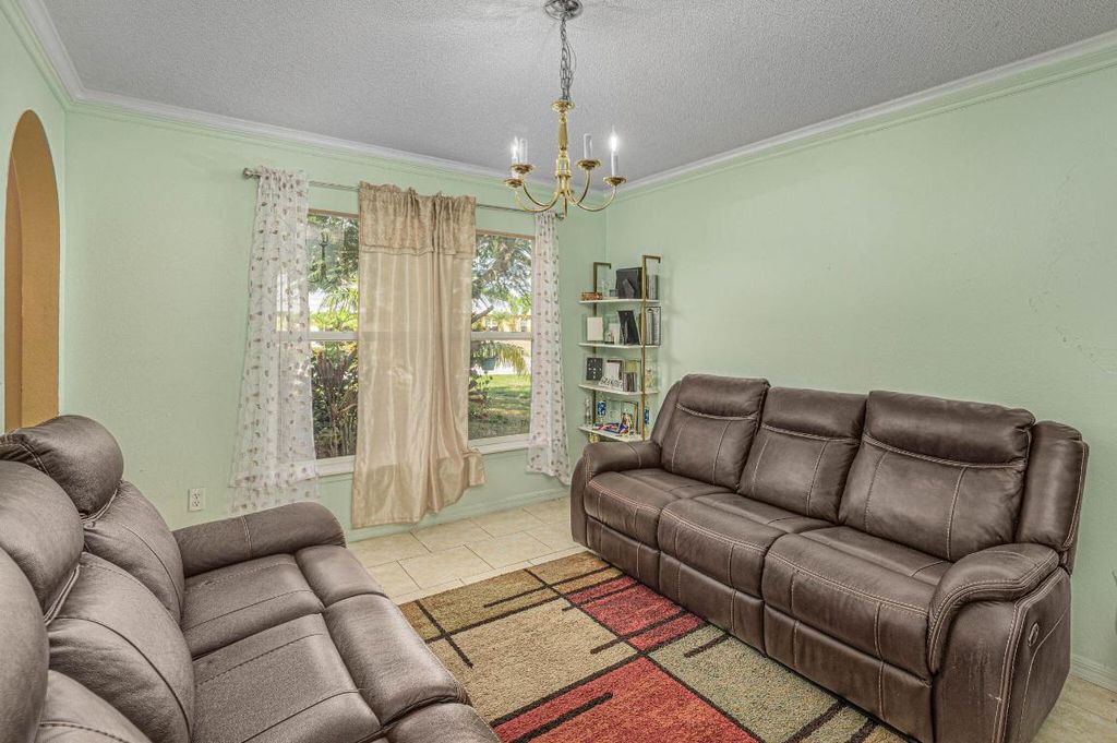 Photo of 1038 SW Liberty Ave, Port Saint Lucie, FL 34953 (MLS # R10935193)