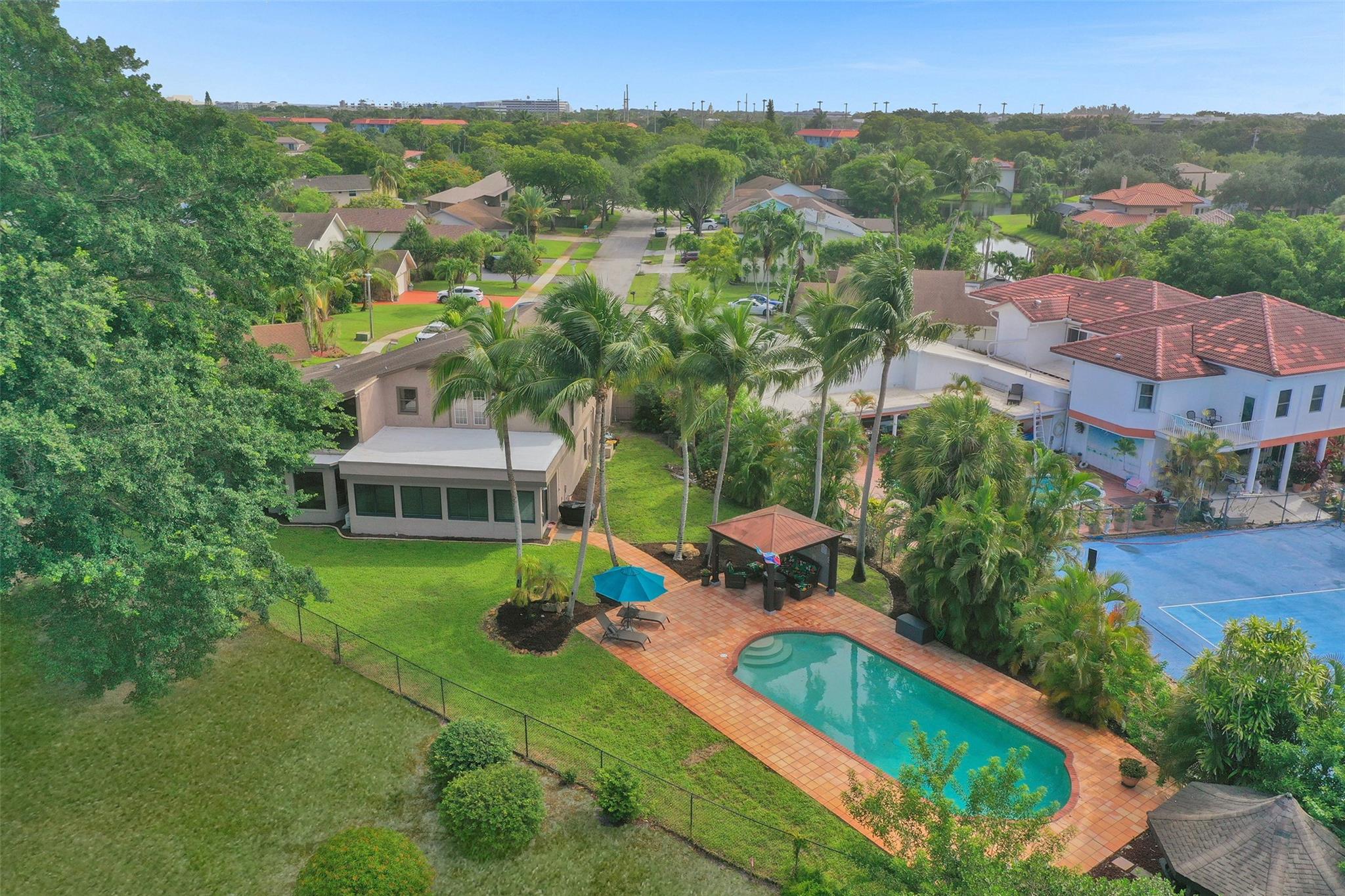 Unforgettable 5-bed, 3-bath gem at the end of a quiet cul-de-sac in Jacaranda Country Club! Over 3,400 sq ft, overlooking the beautiful East Course, boasts a resort-style backyard, sparkling pool, 2 gazebos, huge fenced yard—perfect for entertaining. Step inside to a dramatic spiral iron staircase, riverbend stone fireplace. Custom gourmet kitchen: granite counters, maple cabinetry, SS appliances, butler pantry, coffee station. 4 bedrooms and two full baths downstairs. Upstairs, the luxe primary suite stuns with 2 walk-in closets, spa-style bath, glass-enclosed shower, bidet, French doors open to private deck. Attached loft makes a perfect office, gym. Two laundry centers (up/downstairs), 2 car garage-insulated door. No HOA! Minutes to shopping, dining, and highways—this home has it ALL!