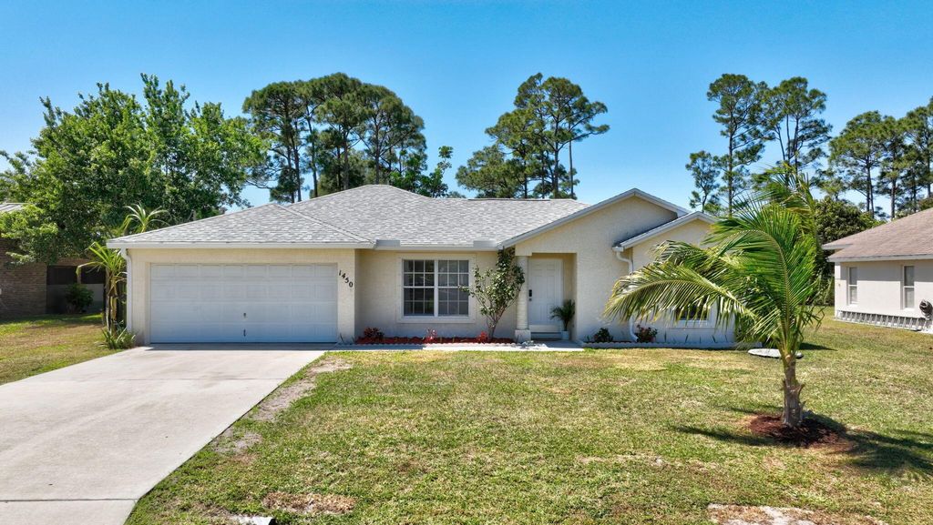Photo of 1450 SE Manth Lane, Port Saint Lucie, FL 34983 (MLS # R11071684)