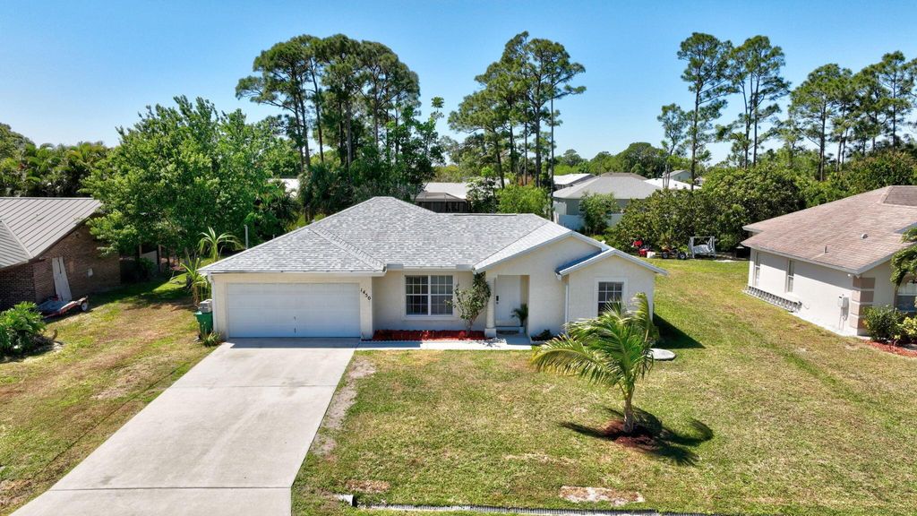 Photo of 1450 SE Manth Lane, Port Saint Lucie, FL 34983 (MLS # R11071684)