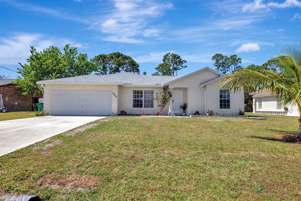 Photo of 1450 SE Manth Lane, Port Saint Lucie, FL 34983 (MLS # R11071684)