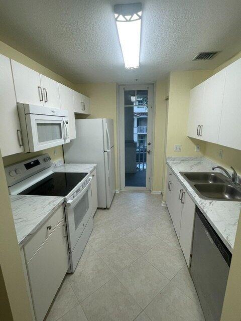 Photo of 1136 TOWN CENTER Drive #23, Jupiter, FL 33458 (MLS # B26073240)