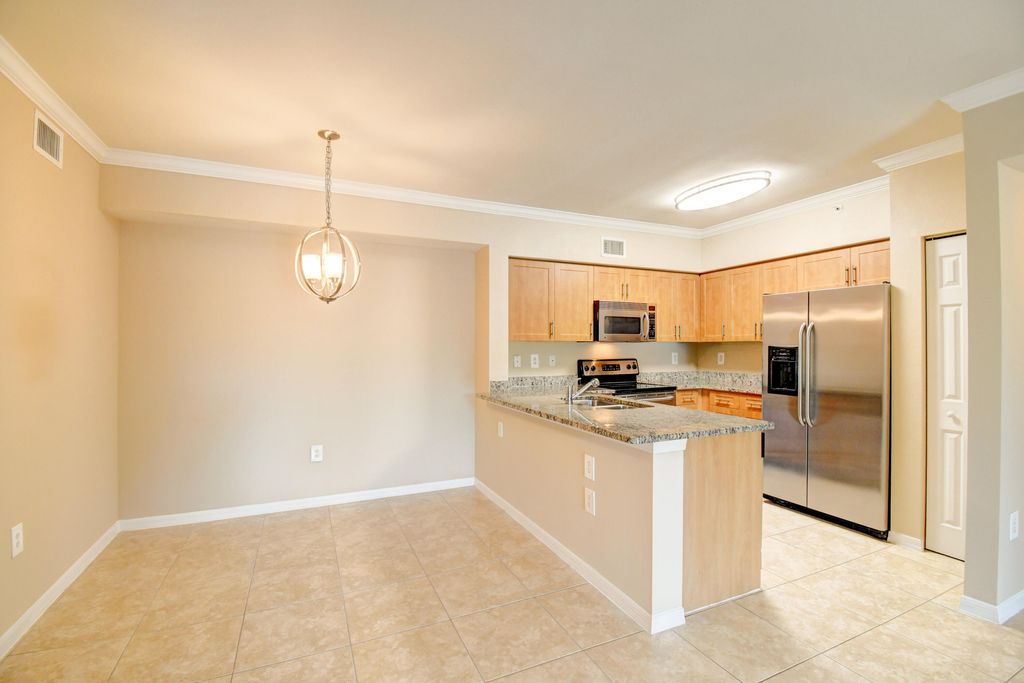 Photo of 6505 Emerald Dunes Drive #201, West Palm Beach, FL 33411 (MLS # B26005241)