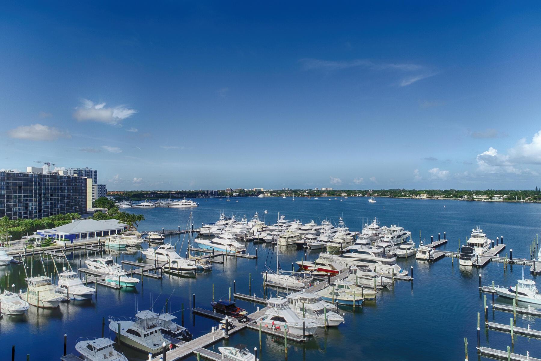 Wake up to sweeping views of the Intracoastal, Old Port Cove Marina, and the Atlantic Ocean from every room of this beautifully updated 2-bedroom, 2.5-bathroom condo. Located on the 7th floor, this residence offers a luxurious coastal lifestyle in one of the area's premiere gated communities. Step into a grand foyer that opens to a spacious living area, perfect for entertaining, complete with a built-in bar and floor-to-ceiling windows that showcase the stunning water views. The updated kitchen features sleek stainless steel appliances, modern cabinetry, and ample counter space. Retreat to the remodeled master suite, featuring 2 walk-in closets, an oversized walk-in shower with a bench, dual vanities, and a private water closet. The guest suite is equally inviting with its own walk-in