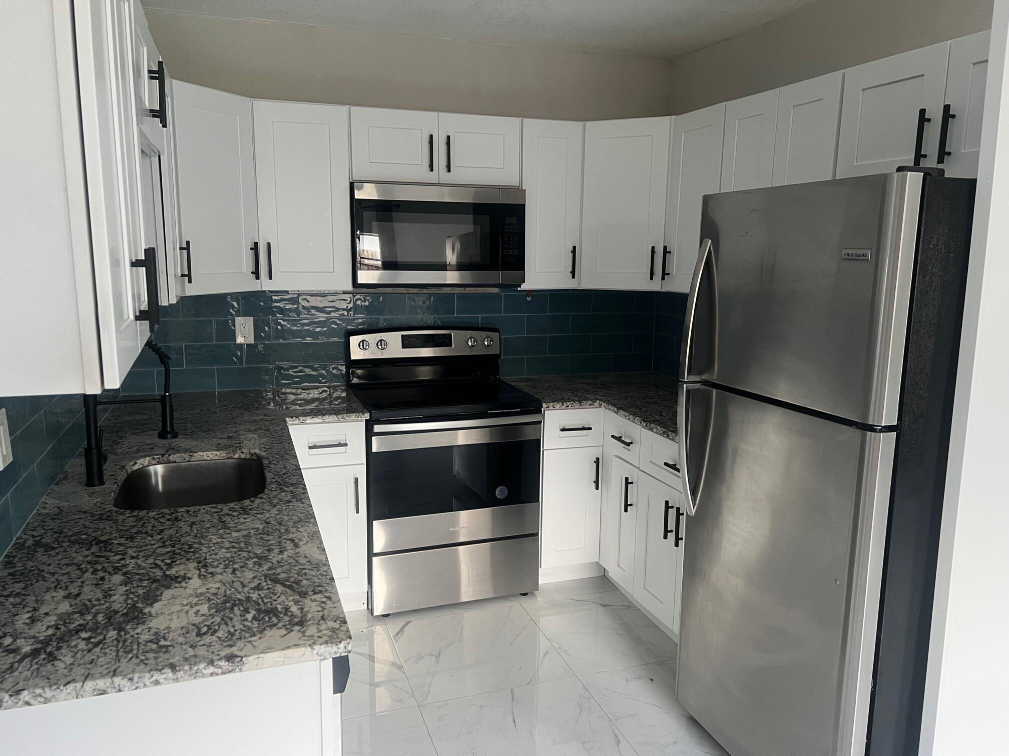 Gorgeously Updated 4 Bedroom, 2 Bath Rental Conveniently Located Only Minutes from Singer Island Beaches. Upgrades Includel; Modern Tilework Throughout, No Carpet Anywhere. Granite Countertops, Stainless Steel Appliances, Generous Master Suite with Large Walk-In Closet & Incredible Master Bathroom. In-Unit Washer & Dryer Available, Large Fenced in Yard, Storage Shed. Immediate Proximity to City Parks, Schools & Recreation Center.