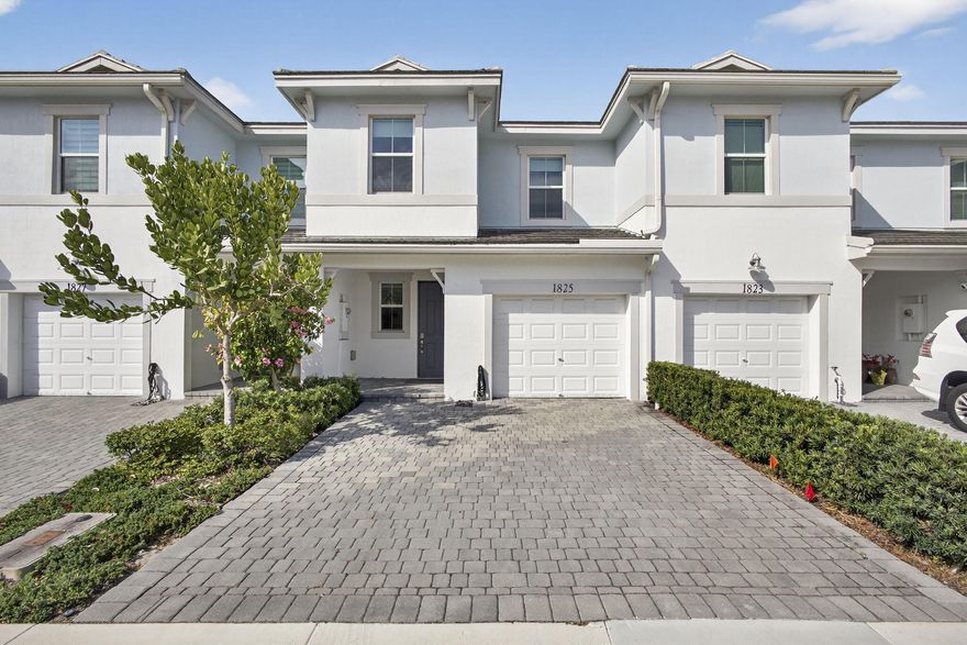 Step into a home defined by refined craftsmanship, impact windows, and attention to detail in this beautifully appointed 3-bedroom, 2.5-bath townhome located within the gated community of Sandpiper Pointe in Deerfield Beach, Florida. Built by Toll Brothers and thoughtfully designed for modern living, this residence blends quality construction with stylish, low-maintenance comfort. The bright, open-concept main level is ideal for both entertaining and everyday living, featuring a chef-inspired kitchen with Whirlpool stainless steel appliances, water filtration system, quartz countertops, abundant cabinetry, and seamless flow into the expansive great room. Wood-look tile flooring adds warmth and durability throughout the main living areas. Upstairs, plush carpeting on the staircase and throughout the second level enhances comfort. Generously sized bedrooms, a versatile loft perfect for a home office or flex space, and a dedicated laundry room provide functionality without sacrificing style. The spacious primary suite offers a walk-in closet and a well-appointed bath designed for everyday ease.

Step outside to your private turfed backyard -- a beautifully finished, low-maintenance outdoor space ideal for relaxing or entertaining. The one-car garage includes a Tesla charger for modern convenience. Residents enjoy resort-style amenities including a pool, fitness center, and playground, all just seconds from major highways, shopping, and dining. Schedule your private showing today.