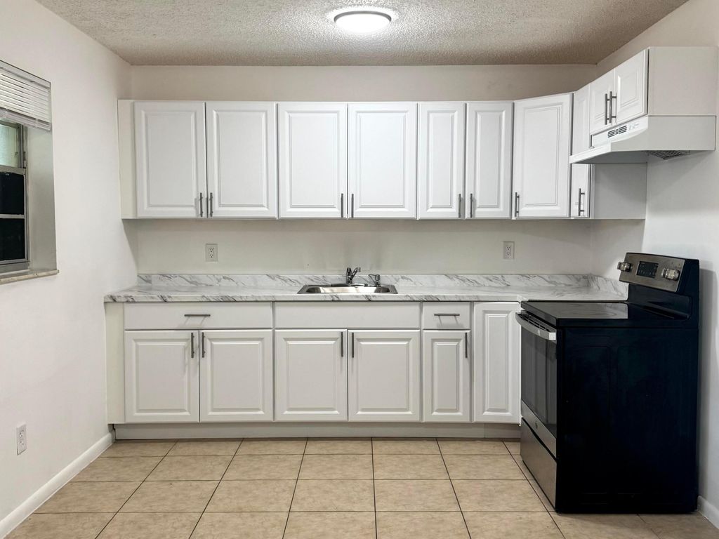 Photo of 3072 Martin Avenue, Greenacres, FL 33463 (MLS # R11164898)