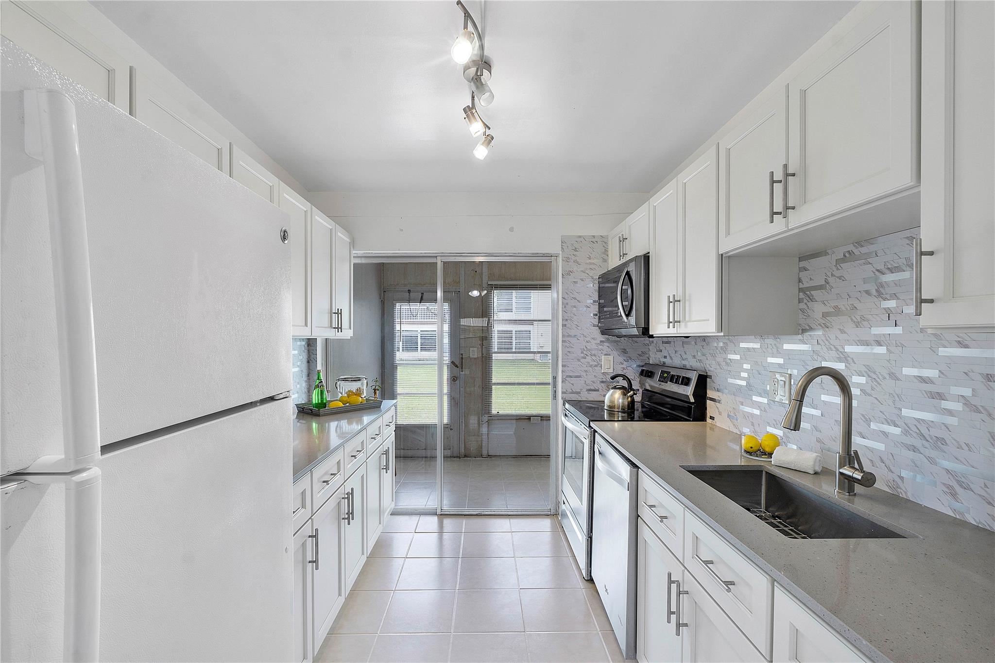 Seller Financing Option is Available! Updated with exquisite finishes! Beautiful, bright, and spacious 1st Floor Condo in highly sought-after Oriole Gardens! This spacious 1BD 1BA condo Features new wood cabinets, quartz counters, refinished tile floors throughout, & laminated floors in the bedroom! Lots of natural light and, a private screened patio overlooking wide garden views. Conveniently located near the clubhouse and pool. Next door to common Laundry and Storage room. Assoc. requirements include: 55+ comm., a min. credit score of 675, no pets allowed, buyer min. income of $35K/year, 20% down payment for financed purchases, and no renting allowed during the first 3 years. The community offers a wide range of amenities: a clubhouse, exercise room, pool and scenic walking trails++