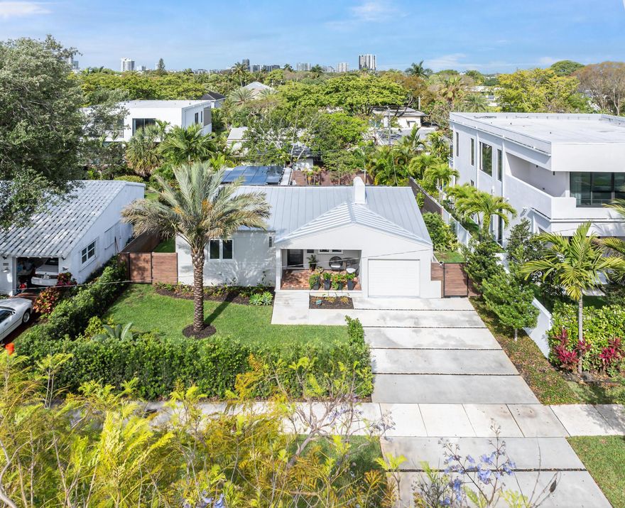 Fully renovated, turnkey 4BR/3BA home in Victoria Park with flexible cabana featuring private entry and full bath, ideal for gym, office, or separate workspace. Interior highlights include hardwood floors, custom built-ins, ambient lighting, and a redesigned kitchen with Bosch appliances, Italian cabinetry, and quartz countertops. The property is located in Flood Zone X and equipped with a full solar system and Tesla backup battery, offering energy efficiency and continuity without the need for a generator. Additional features include a metal roof (approx. 5.5 years), impact windows/doors, and instant hot water. Outdoor space includes a heated saltwater pool/spa, cabana bath, new driveway, and mature landscaping. Well positioned near Las Olas, the beach, parks, and everyday conveniences.